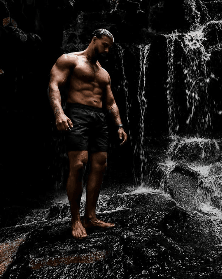 Don of Don Coaching standing beside a waterfall